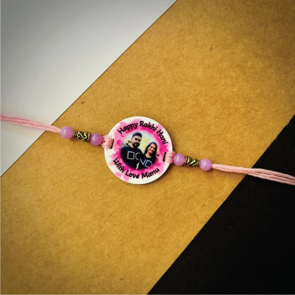 100-1-no-gift-color-splash-phote-names-rakhipink-1.webp Color Splash Phote Names Rakhi Pink - Personalised Rakhi for Brother by Bubbly Decors