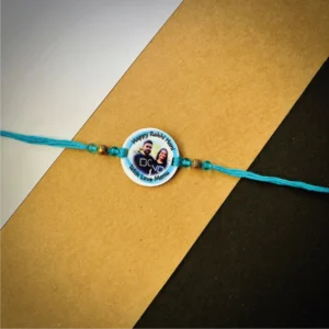 103-1-no-gift-color-photo-names-rakhiblue-1.webp Color Photo Names Rakhi Blue - Personalised Rakhi for Brother by Bubbly Decors