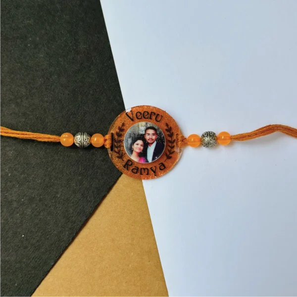 118-1-no-gift-bronze-metalic-photo-namesrakhi-1.webp Bronze Metalic Photo Names Rakhi - Personalised Rakhi for Brother by Bubbly Decors