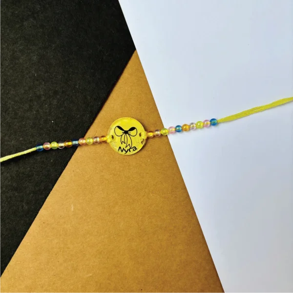 126-1-no-gift-baby-ribbonrakhi-1.webp Baby Ribbon Rakhi - Personalised Rakhi for Brother by Bubbly Decors
