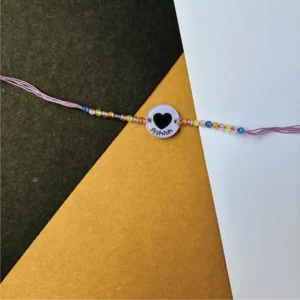 129-1-no-gift-baby-heartrakhi-1.webp Baby Heart Rakhi - Personalised Rakhi for Brother by Bubbly Decors