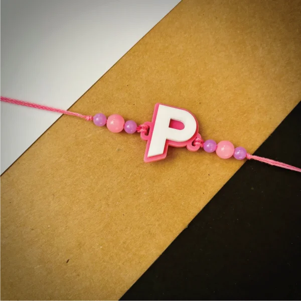 143-1-no-gift-alphabet-rakhigray-1.webp Alphabet Rakhi Gray - Personalised Rakhi for Brother by Bubbly Decors