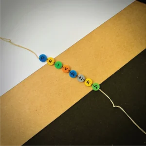 146-1-no-gift-alphabet-buttonsrakhi-1.webp Alphabet Buttons Rakhi - Personalised Rakhi for Brother by Bubbly Decors
