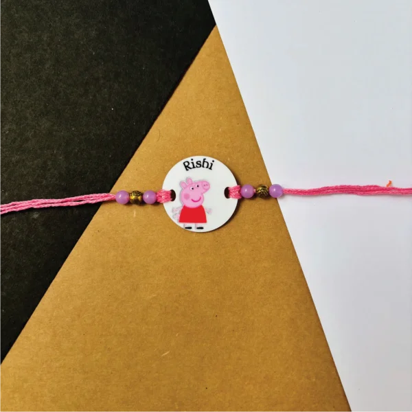 36-1-no-gift-peppa-pigrakhi-1.webp Peppa Pig Rakhi - Personalised Rakhi for Brother by Bubbly Decors