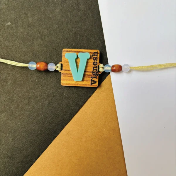 4-1-no-gift-wood-initial-name-rakhiblue-1.webp Wood Initial Name Rakhi Blue - Personalised Rakhi for Brother by Bubbly Decors