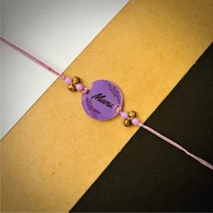 43-1-no-gift-name-painted-rakhipurple-1.webp Name Painted Rakhi Purple - Personalised Rakhi for Brother by Bubbly Decors