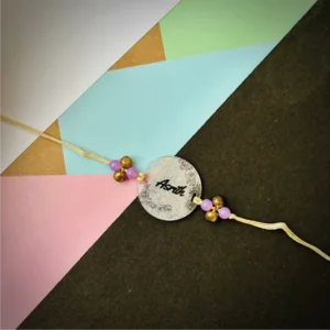 45-1-no-gift-name-painted-rakhisilver-1.webp Name Painted Rakhi Silver - Personalised Rakhi for Brother by Bubbly Decors