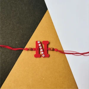 46-1-no-gift-name-on-alphabet-rakhired-1.webp Name On Alphabet Rakhi Red - Personalised Rakhi for Brother by Bubbly Decors