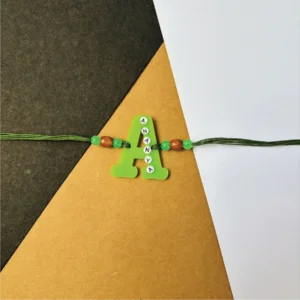 47-1-no-gift-name-on-alphabet-rakhigreen-1.webp Name On Alphabet Rakhi Green - Personalised Rakhi for Brother by Bubbly Decors