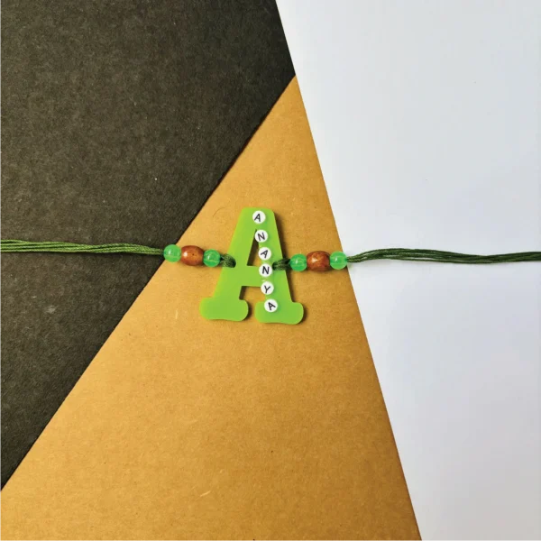 47-1-no-gift-name-on-alphabet-rakhigreen-1.webp Name On Alphabet Rakhi Green - Personalised Rakhi for Brother by Bubbly Decors