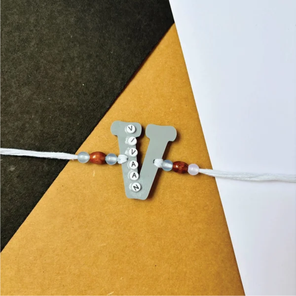 48-1-no-gift-name-on-alphabet-rakhigray-1.webp Name On Alphabet Rakhi Gray - Personalised Rakhi for Brother by Bubbly Decors