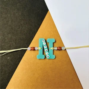 49-1-no-gift-name-on-alphabet-rakhiblue-1.webp Name On Alphabet Rakhi Blue - Personalised Rakhi for Brother by Bubbly Decors