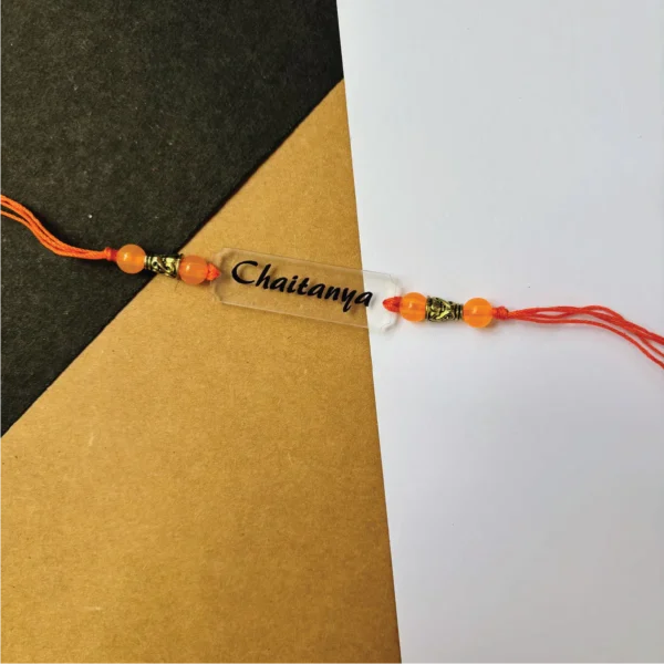 50-1-no-gift-name-engravedrakhi-1.webp Name Engraved Rakhi - Personalised Rakhi for Brother by Bubbly Decors