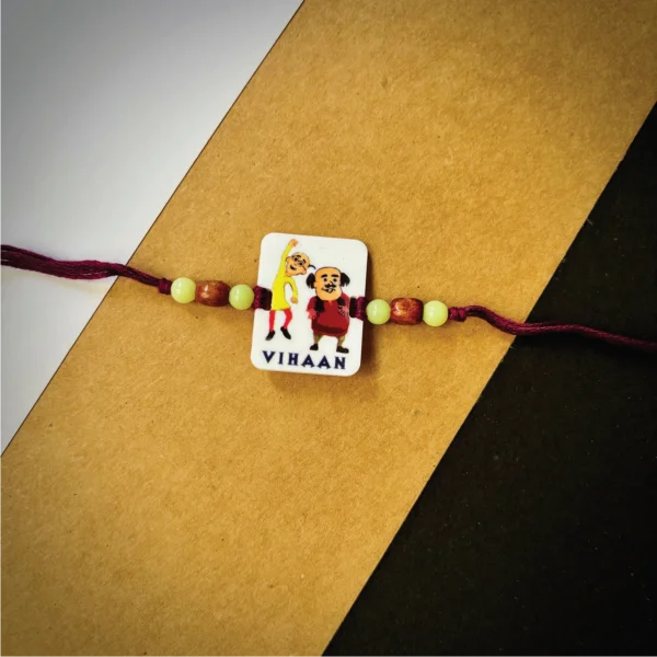 51-1-no-gift-motu-patlurakhi-1.webp Motu Patlu Rakhi - Personalised Rakhi for Brother by Bubbly Decors
