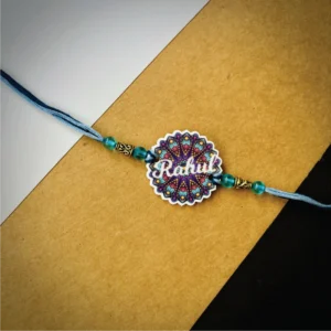 55-1-no-gift-mandala-name-rakhipurple-1.webp Mandala Name Rakhi Purple - Personalised Rakhi for Brother by Bubbly Decors