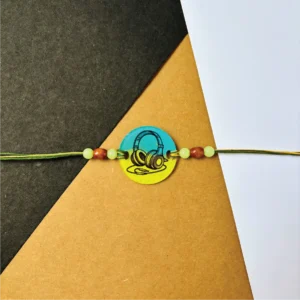 64-1-no-gift-headphone-paintedrakhi-1.webp Headphone Painted Rakhi - Personalised Rakhi for Brother by Bubbly Decors