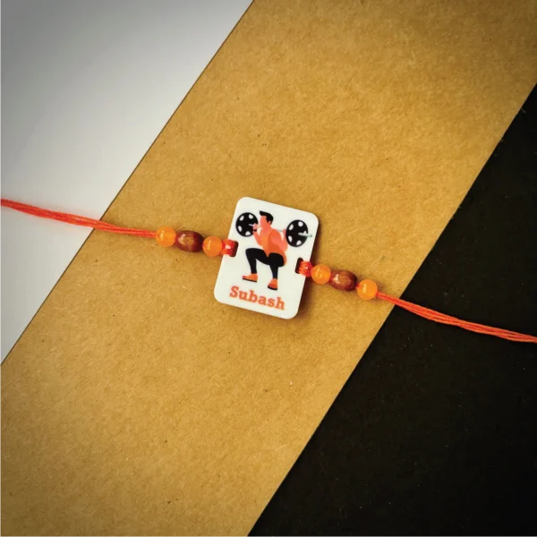 65-1-no-gift-gym-freak-namerakhi-1.webp Gym Freak Name Rakhi - Personalised Rakhi for Brother by Bubbly Decors
