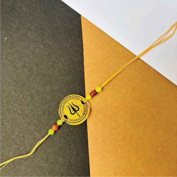 68-1-no-gift-gold-painted-trisulrakhi-1.webp Gold Painted Trisul Rakhi - Personalised Rakhi for Brother by Bubbly Decors