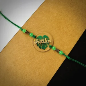 69-1-no-gift-gold-name-on-Leaf-printedrakhi-1.webp Gold Name On Leaf Printed Rakhi - Personalised Rakhi for Brother by Bubbly Decors