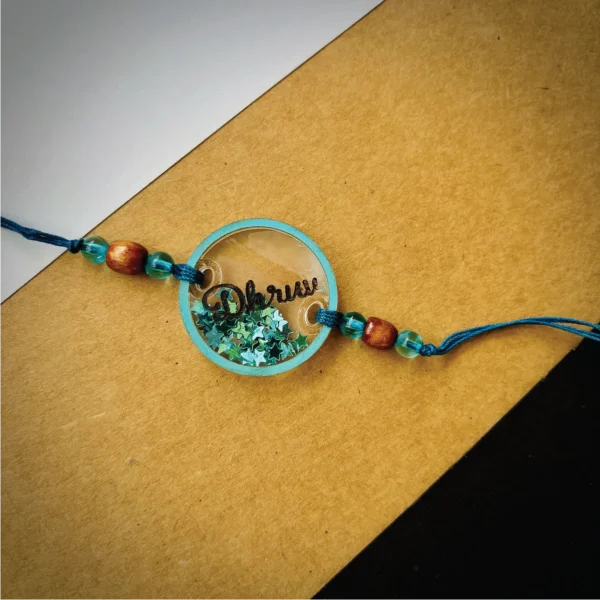 71-1-no-gift-glitters-filled-name-rakhiBlue-1.webp Glitters Filled Name Rakhi Blue - Personalised Rakhi for Brother by Bubbly Decors