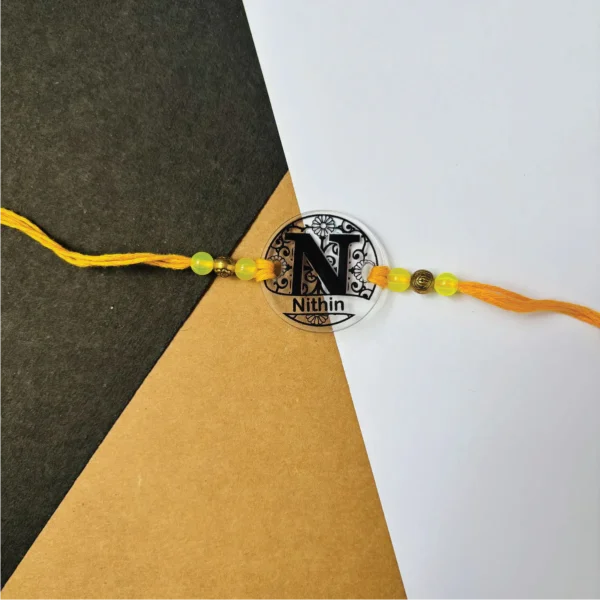 77-1-no-gift-flower-pattern-namerakhi-1.webp Flower Pattern Name Rakhi - Personalised Rakhi for Brother by Bubbly Decors