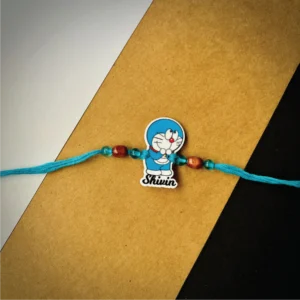 86-1-no-gift-doremon-namerakhi-1.webp Doremon Name Rakhi - Personalised Rakhi for Brother by Bubbly Decors