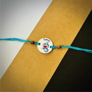 87-1-no-gift-doremon-flying-namerakhi-1.webp Doremon Flying Name Rakhi - Personalised Rakhi for Brother by Bubbly Decors