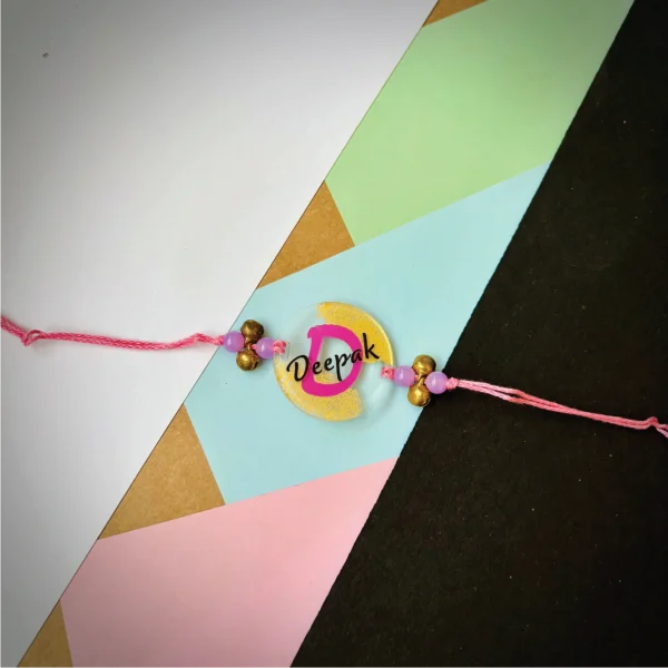 90-1-no-gift-designer-name-with-alphabet-rakhiPink-1.webp Designer Name With Alphabet Rakhi Pink - Personalised Rakhi for Brother by Bubbly Decors