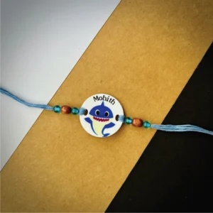 92-1-no-gift-cute-shark-namerakhi-1.webp Cute Shark Name Rakhi - Personalised Rakhi for Brother by Bubbly Decors