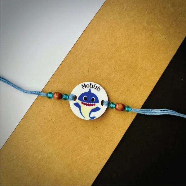 92-1-no-gift-cute-shark-namerakhi-1.webp Cute Shark Name Rakhi - Personalised Rakhi for Brother by Bubbly Decors