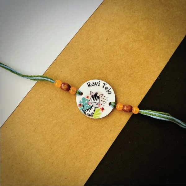 94-1-no-gift-cute-girafee-namerakhi-1.webp Cute Girafee Name Rakhi - Personalised Rakhi for Brother by Bubbly Decors